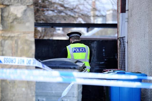 Police at the scene of the murder last February (Pic: Michael Gillen)