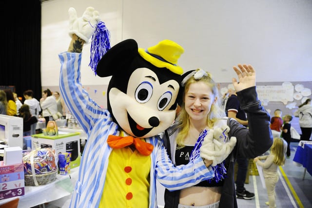 Tyla Law (19) and Mickey Mouse at the fun day.