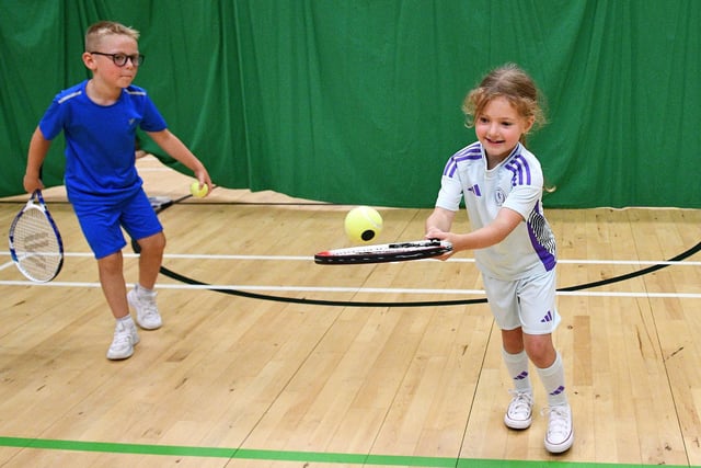 All smiles as the ball is hit.