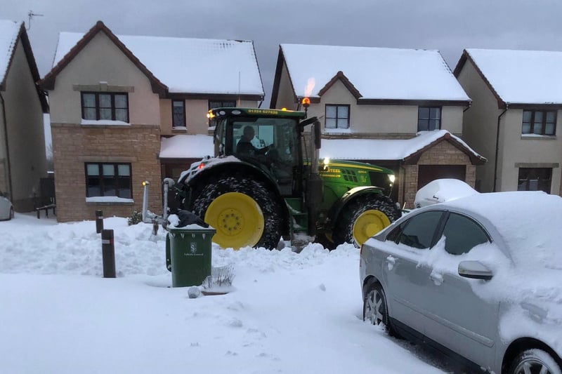 Farmer George Steel was out with his tractor helping to clear streets in Newcarron as spotted by Diane Stevenson