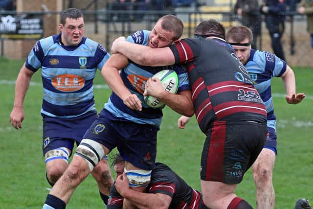 Stefan Yarrow is brought down by an opposition player as he looks to drive forward