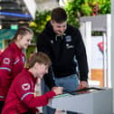 Glasgow Warriors ace Murphy Walker tries out some science experiments with Falkirk High School's Livi Robinson and Henry Wright (Photo: SP Energy Networks)