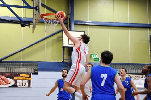 Bryan Munnoch scored a lay-up in the tight first half of Fury's match with Blaze. Pic by Michael Gillen