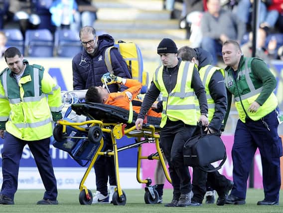 David Mitchell is stretchered off after being injured agaqinst Dunfermline (pic by Michael Gillen)