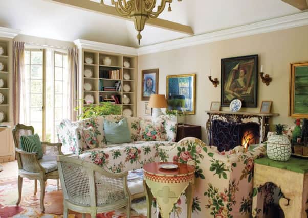 The garden room. An English Rococo fire surround found at an antiques fair completes the renovation of the room. PA Photo/Simon Upton.