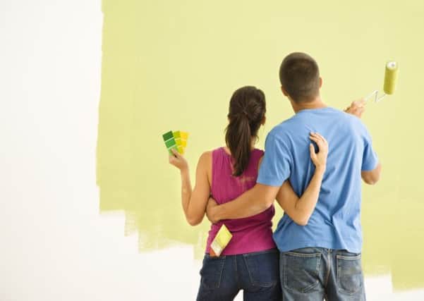 A couple painting walls. See PA Feature HOMES Homes Column. Picture credit should read: PA Photo/thinkstockphotos. WARNING: This picture must only be used to accompany PA Feature HOMES Homes Column.