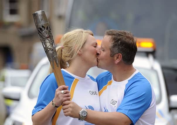 The baton handover is sealed with a kiss
