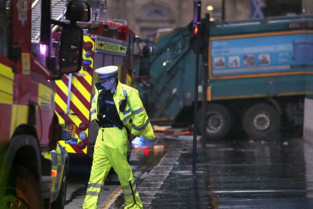 A police officer at the scene of the bin lorry crash in Glasgow