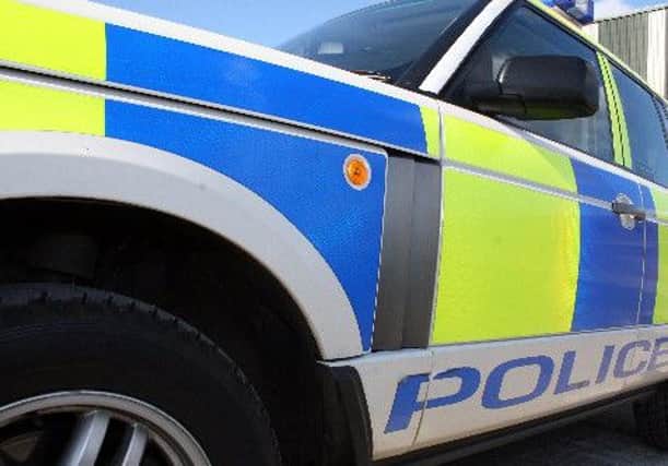 Police are appealing for information after a brick was dropped onto a car on the M80