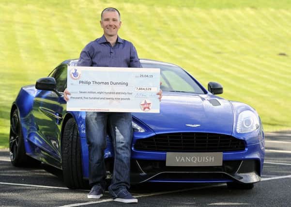 Philip Dunning celebrates his £7.8 million Lotto win
Picture: Michael Gillen