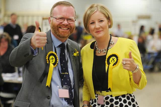 SNP's Martyn Day and Hannah Bardell celebrate victory.