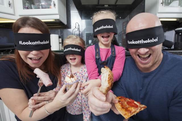 Christine and Iain Livingston of Renfrew with their two children Orla, 7 and Mara, 4 help launch the Food Standards Scotlands #lookatthelabel campaign by showing that if you dont look at the label of food products then you dont know what youre eating.