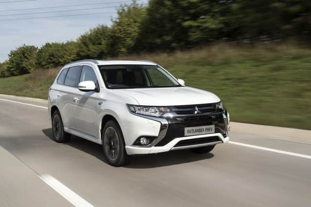 The front exterior of the 2015 Mitsubishi Outlander PHEV.