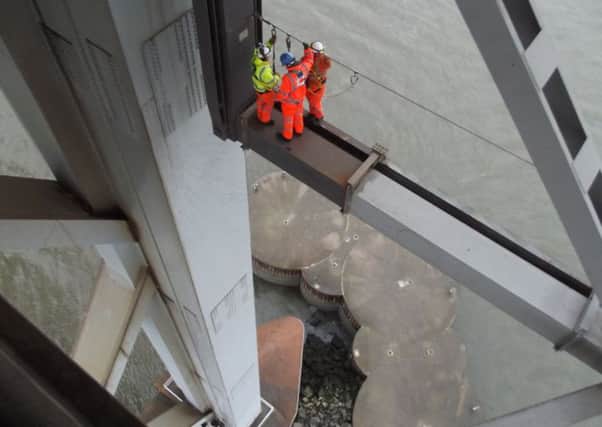 Engineers working to repair the Forth Bridge