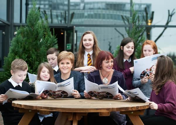 Angela Constance and First Minister Nicola Sturgeon with Westquarter primary pupils at the launch of NIF. Picture: John Devlin
