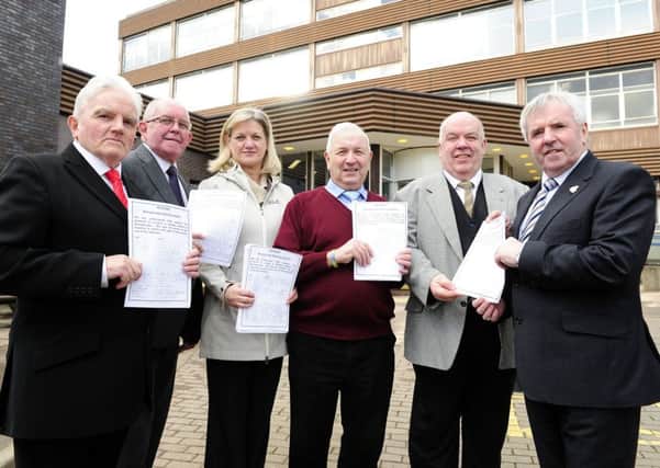 John Aitken and Kenneth Halliday hand over the petition to Councillors Buchanan, Blackwood, Gow and Goldie.