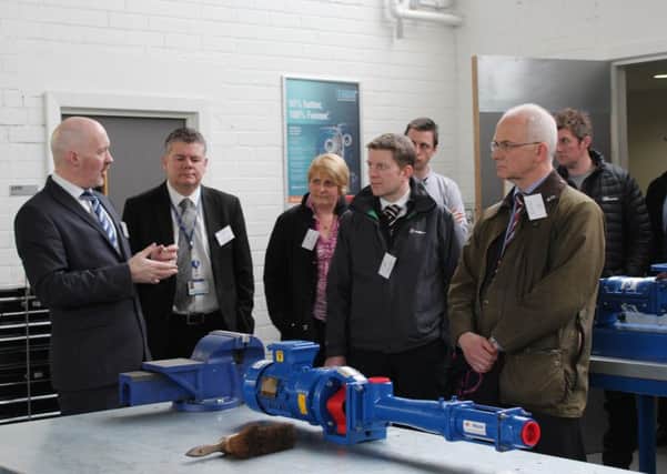 Kenny MacInnes FVCs Head of Applied Science, Maths & Mechanical Engineering (far left) gave the event attendees a tour of the engineering workshops at the Falkirk Campus