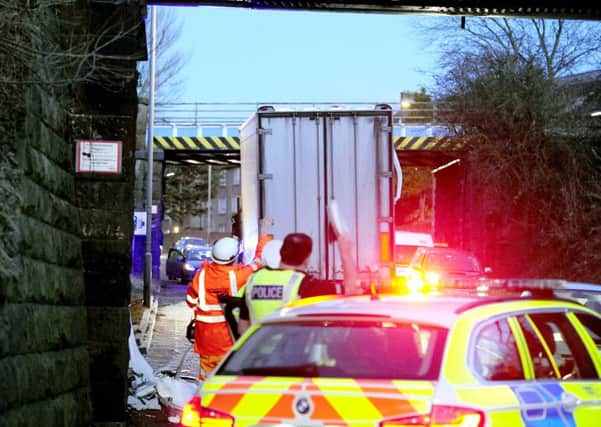 The lorry blocked the route under the bridge causing long delays