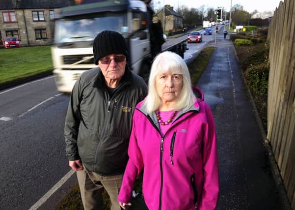 Jean, pictured with husband Alan, says the pollution from vehicles is making her ill