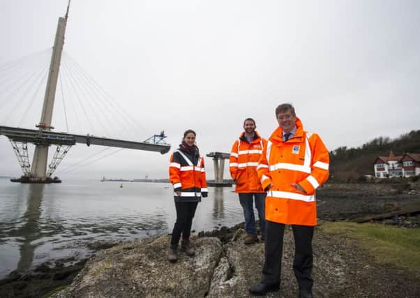 Infrastructure Minister Keith Brown with Jared Carlson and Jennifer Bullingham, engineers who have worked on the launch of the Queensferry Crossing's north approach viaduct.