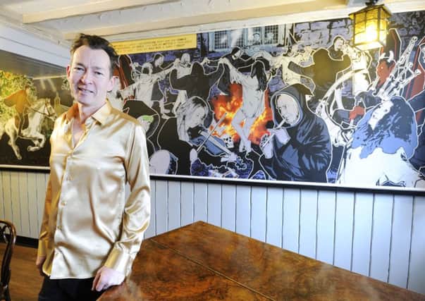 Greg Moodie with his Tam O'Shanter murals
