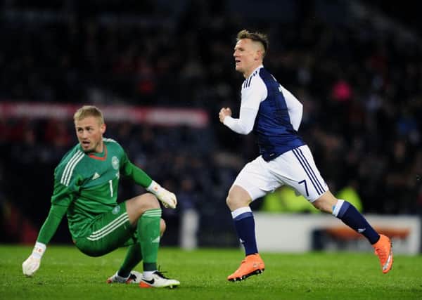 Matt Ritchie watches his shot hit the net after beating former Falkirk goalie Kasper Schmeichel