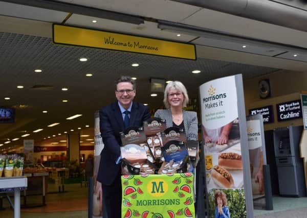 Tilly Confectionary's Elisabeth Paterson and Morrison's Angus Bell celebrate the deal