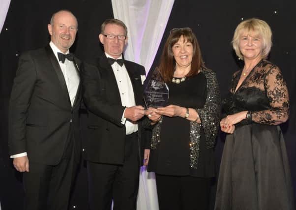 L-R: Comedian Fred MacAulay, Catca's Ian Howarth and Christine Bell and category sponsor Sharon Bolton of the University of Stirling Management School
