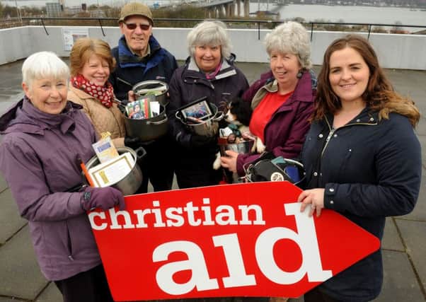 Christian Aid fundraisers with their cooking pots near the Forth Road Bridge.