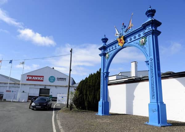 The historic Grahamston Gate, right, which sits outside the Carron Phoenix plant symbolises the history of work at the site dating back to 1759. Picture: Michael Gillen