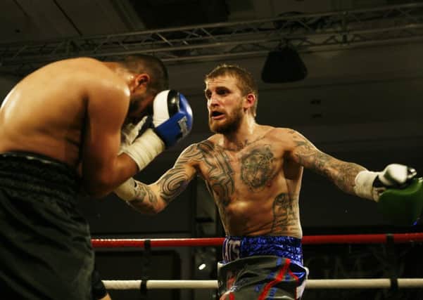 Stevie Beattie wins his second pro fight. Picture James Clare.