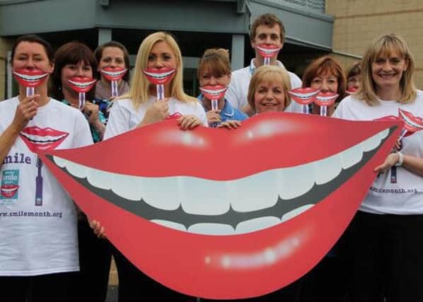 NHS 24 is promoting its dental service as part of National Smile Month.