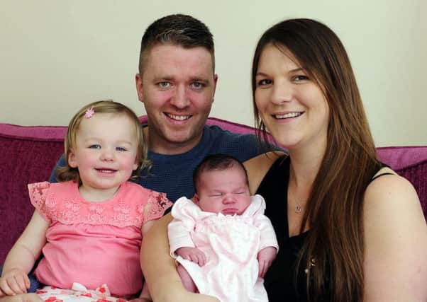 Supermum Louise and dad Martin with Millie and little Aila. Picture: Michael Gillen