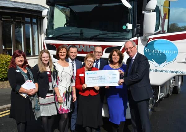 Iain Mitchell presents the Â£60,000 cheque to Strathcarron Hospice