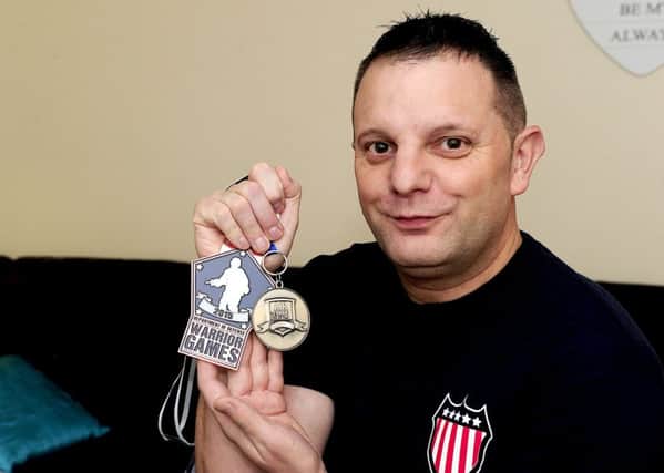 Daniel Hutchison with his Warrior Games medals. Picture: Michael Gillen