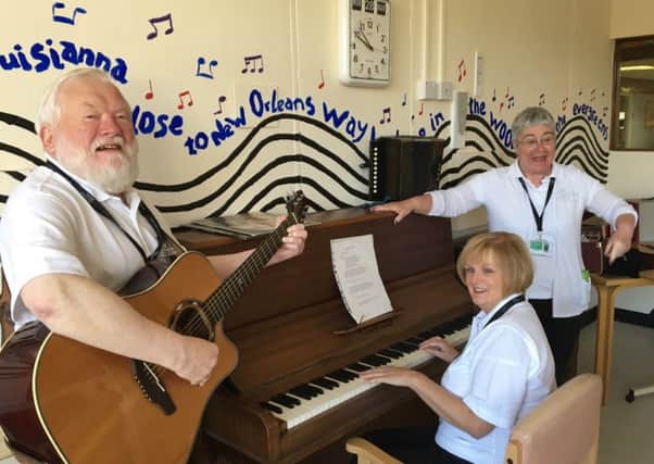 On-ward and on song, volunteers Sean Walsh, Margaret Gillespie and Morag Walsh brighten up lives