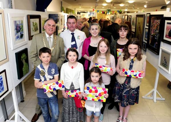 The opening of Falkirk & District Art Club annual exhibition with Provost Pat Reid, president Bob Macintosh and junior members. Picture: Michael Gillen