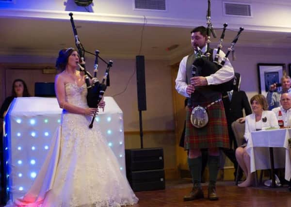Guests were thrilled to be entertained by the bride and groom playing the pipes on their wedding day