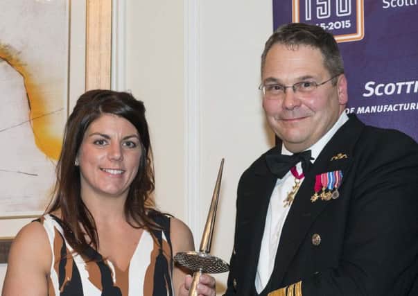 Forth Ports harbour master Ashley Nicholson receives her award from Vice Admiral Simon Lister