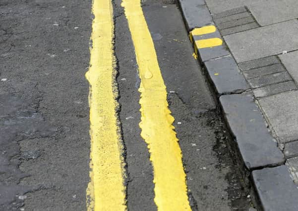 Double yellow lines will be added to the road