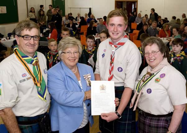 Scott Walton recieves his Queen's Scout Award from Lord Lieutenant Marjory McLachlan