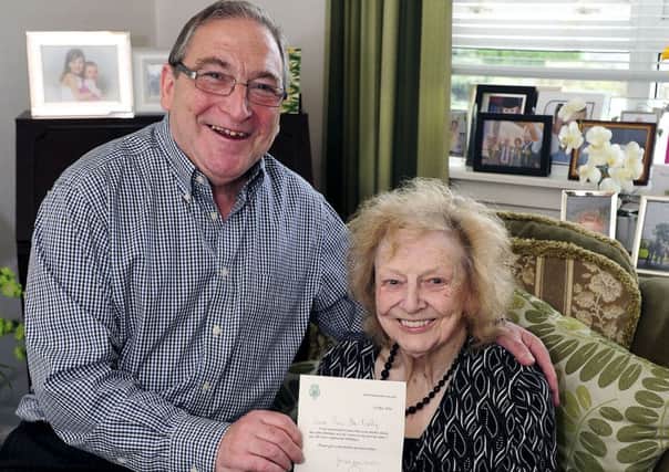 Rosa McNally with son John McNally MP and letter from Prince Philip
Picture: Michael Gillen