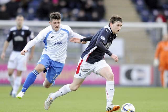 17-01-2015. Picture Michael Gillen. FALKIRK. Falkirk Stadium. Falkirk FC v Queen of the South. SPFL Championship. Lewis Kidd 12 tugs at Blair Alston 8.