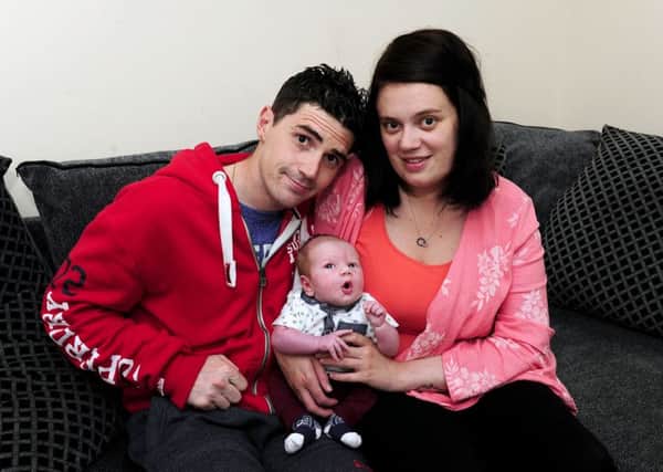 Michelle and Bryon with baby Leon who was born after Michelle only discovered she was pregnant four weeks before the birth. Picture: Michael Gillen