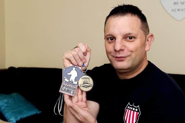 Danny Hutchison, pictured with his Warrior Games medals, admitted assaulting his girlfriend following an argument. Picture: Michael Gillen