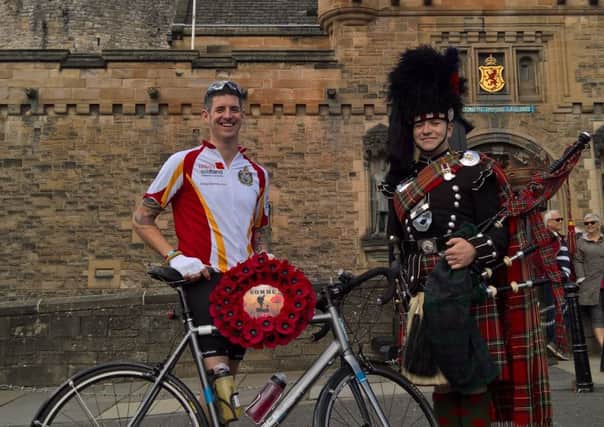 Evan Finnegan before being piped off by Jamie Bell of the Scots Gurads Pipes & Drums at Edinburgh Castle on Monday