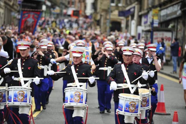 Crowds flocked to support the bands as they marched through the town