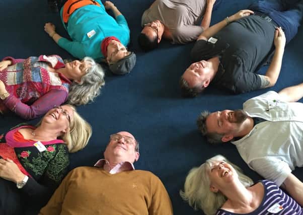 Laughter yoga employs games and songs to help get people laughing like they did when they were children