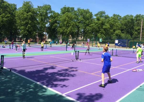 Youngsters hit some balls on Zetland Park Tennis Courts