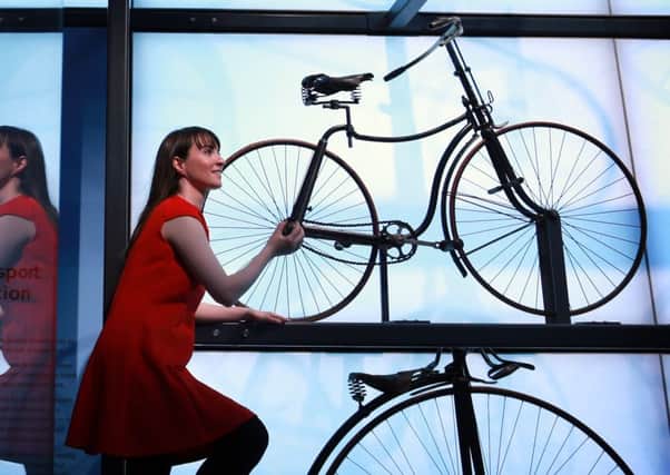 Wheely inspired...the museums Kirsten Cowie with historic bicycle display. Stewart Attwood.